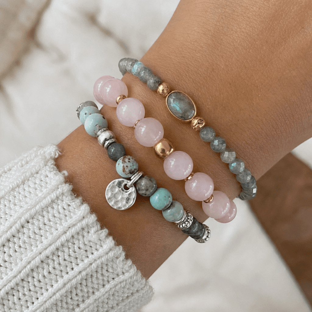 Three gemstone bracelets stacked with mixed metals and bead sizes