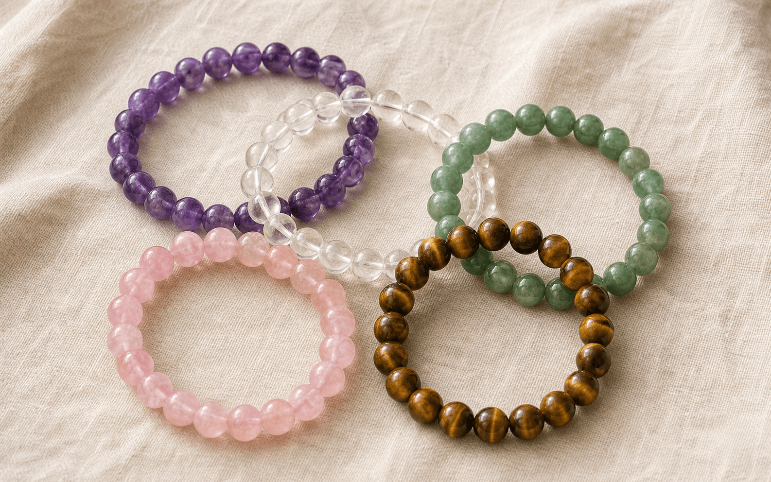 Amethyst bracelet stacked with the five element crystal colors